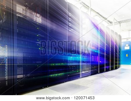 room with rows of server hardware in the data center
