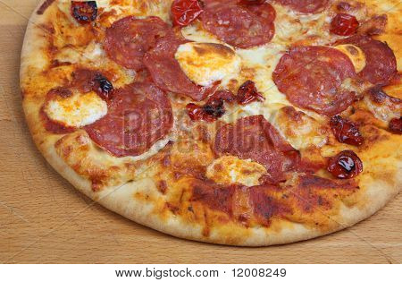 Tuscan Pizza with salami, mascapone cheese and sun-dried tomatoes