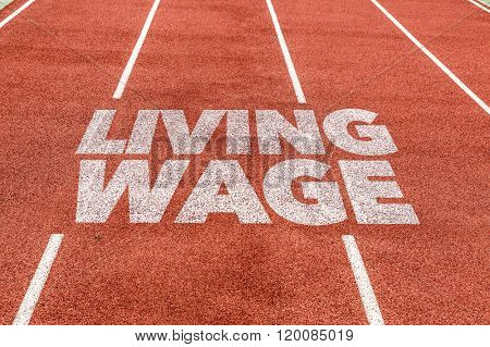 Living Wage written on running track