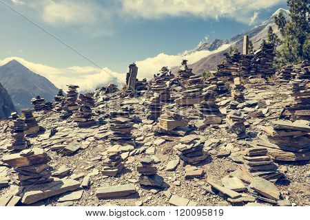 Stone piles with mountain on background.