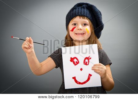 Little Painter Girl With A Drwan Smile Isolated On Grey