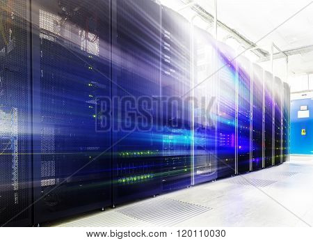 room with rows of server hardware in the data center