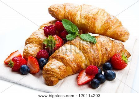 Fresh Tasty Croissants With Berries On White Background