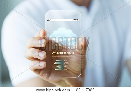 business, technology, weather cast and people concept - close up of male hand holding and showing transparent smartphone with meteo forecast