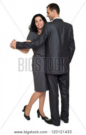 Couple dance, studio portrait on white. Dressed in black suit.