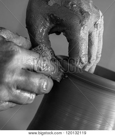 Potter working clay