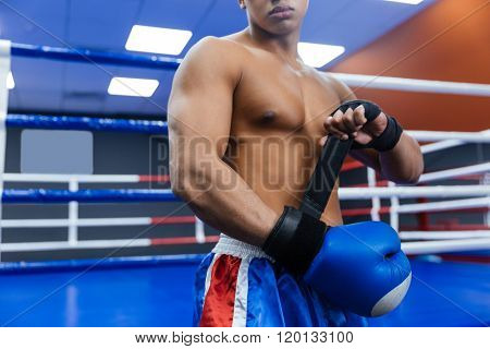Cropped image of a boxer getting ready for fight