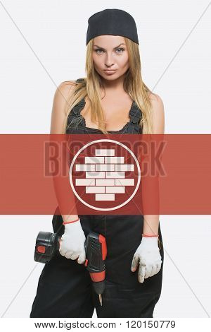 sexy female holding a cordless screwdriver. brickwork icon in the background woman.