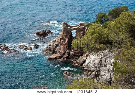 Stone Grotto With An Observation Platform On The Cliff.
