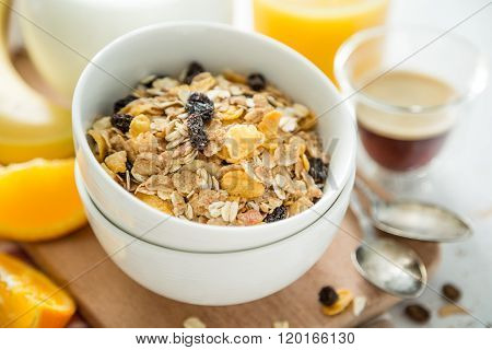 Breakfast - muesli and fruits on white background