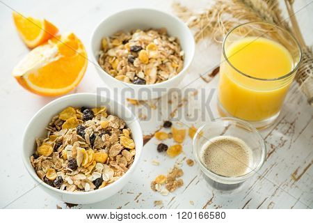 Breakfast - muesli and fruits on white background