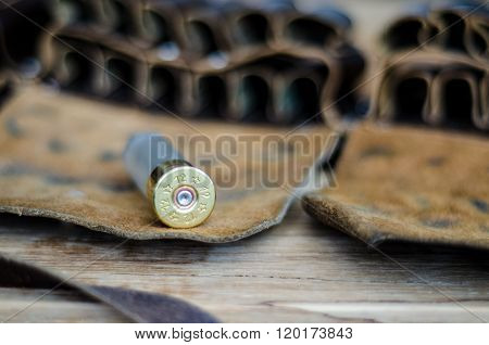 Old Hunting Cartridge And Bandoleer On A Wooden Table