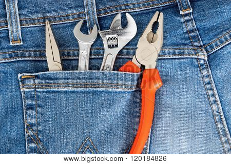 Toolkit Of Four Items In A Blue Jeans Pocket