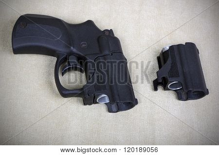 Tubeless Doubly Charged Traumatic Pistol And Holder. Image With Vignette
