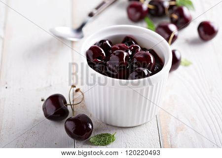 Homemade cherry sauce in white ramekin