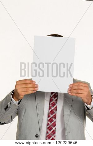 manager holding blank sheet in front of face
