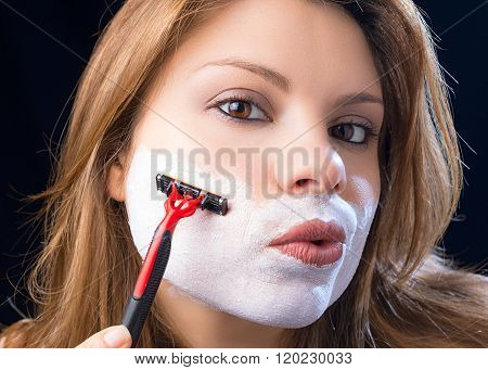woman shaves beard