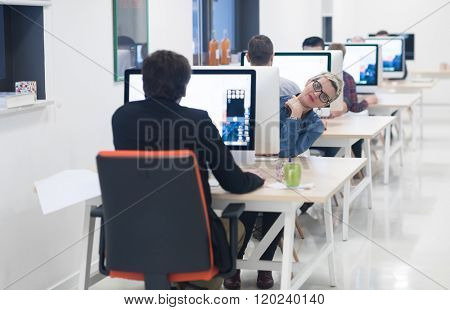 startup business, woman  working on dektop  computer at creative modern office relaxing and have fun