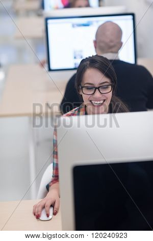 startup business, woman  working on dektop  computer at creative modern office relaxing and have fun