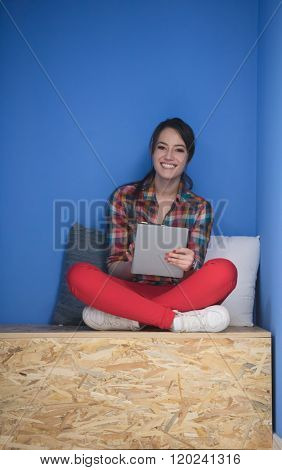 young woman in crative box working on tablet computer, startup business modern office room  interior
