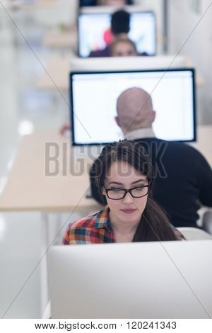 startup business, woman  working on dektop  computer at creative modern office relaxing and have fun
