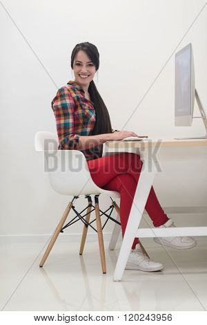startup business, woman  working on dektop  computer at creative modern office relaxing and have fun