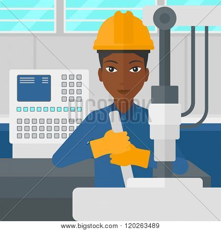 Woman working with industrial equipment.