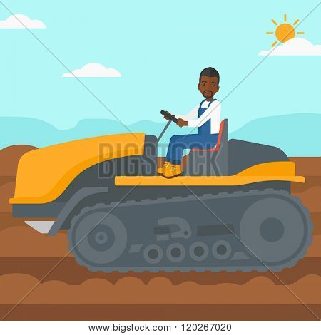 Farmer driving catepillar tractor.