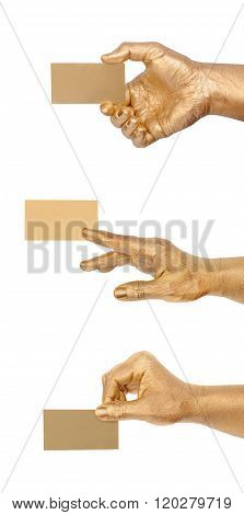 Man's golden hand holding an empty business card