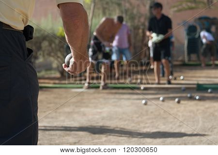 Senior playing petanque