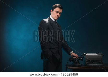 Vintage 1940S Business Man In Suit And Tie Hanging Up The Phone.