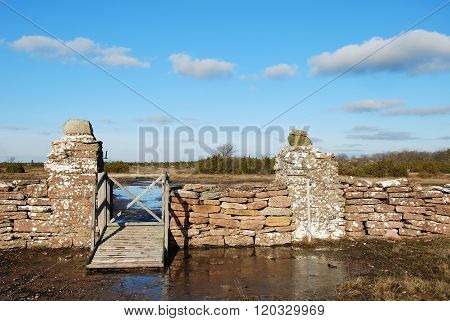 Old Gate By A Stone Wall