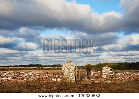 Trail With A Gate By An Old Stone Wall