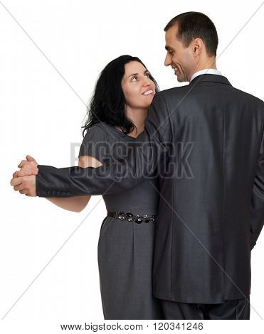 Couple dance, studio portrait on white. Dressed in black suit.