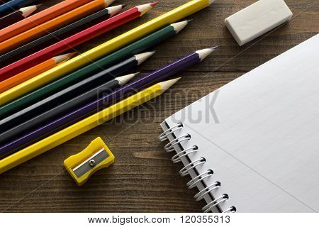 Crayons, Notebook , Eraser And Pencil Sharpener