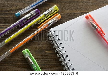 Multicolored Ballpoint Pens And Notebook
