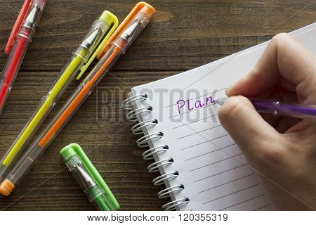 Multicolored Ballpoint Pens , Notebook And Hand