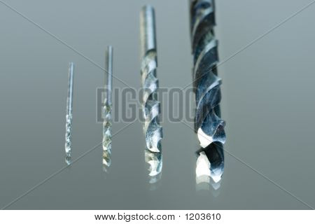 Four Drills On A Glass.