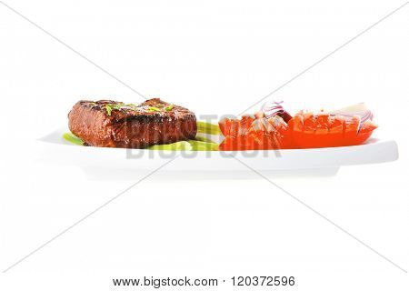 beef meat served with tomato on white porcelain