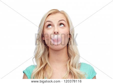 emotions, expressions and people concept - happy young woman or teenage girl chewing gum