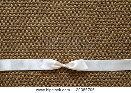 Satin Bow On Sisal Background