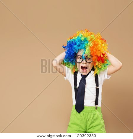 Happy Clown Boy With Large Colorful Wig.
