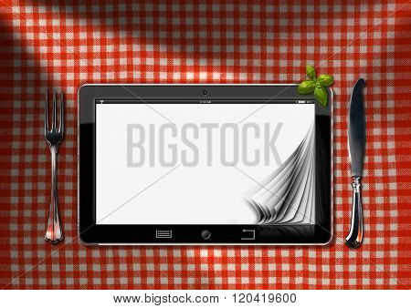 Tablet And Cutlery On A Table With Tablecloth