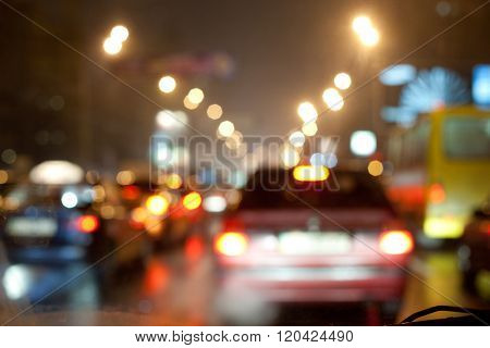 Night traffic jam in the city. Blurred bokeh postcard.