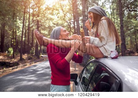 Young couple traveling by car in the forest