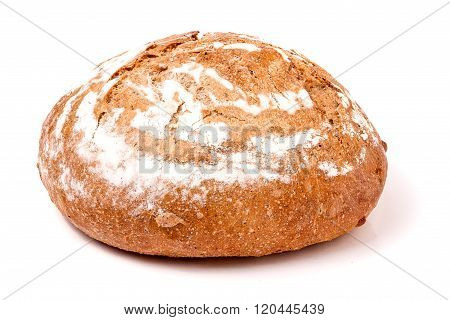 loaf of freshly baked bread floured on white background