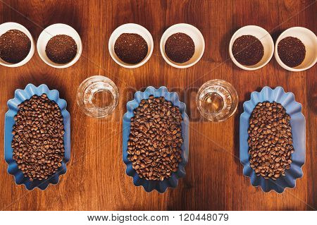 Perfect rows of containers with beans and ground coffee