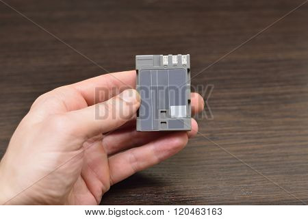 Hand Shows How To Recharge Battery