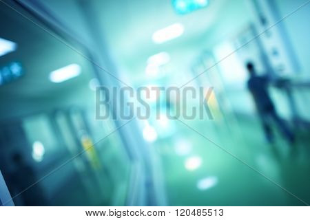 Man Sneaks In The Dark Corridor Of Building