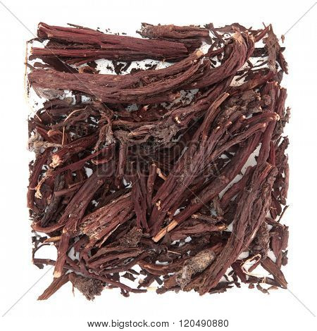 Alkanet root herb used in natural alternative medicine over white background. Alkanna tinctoria.